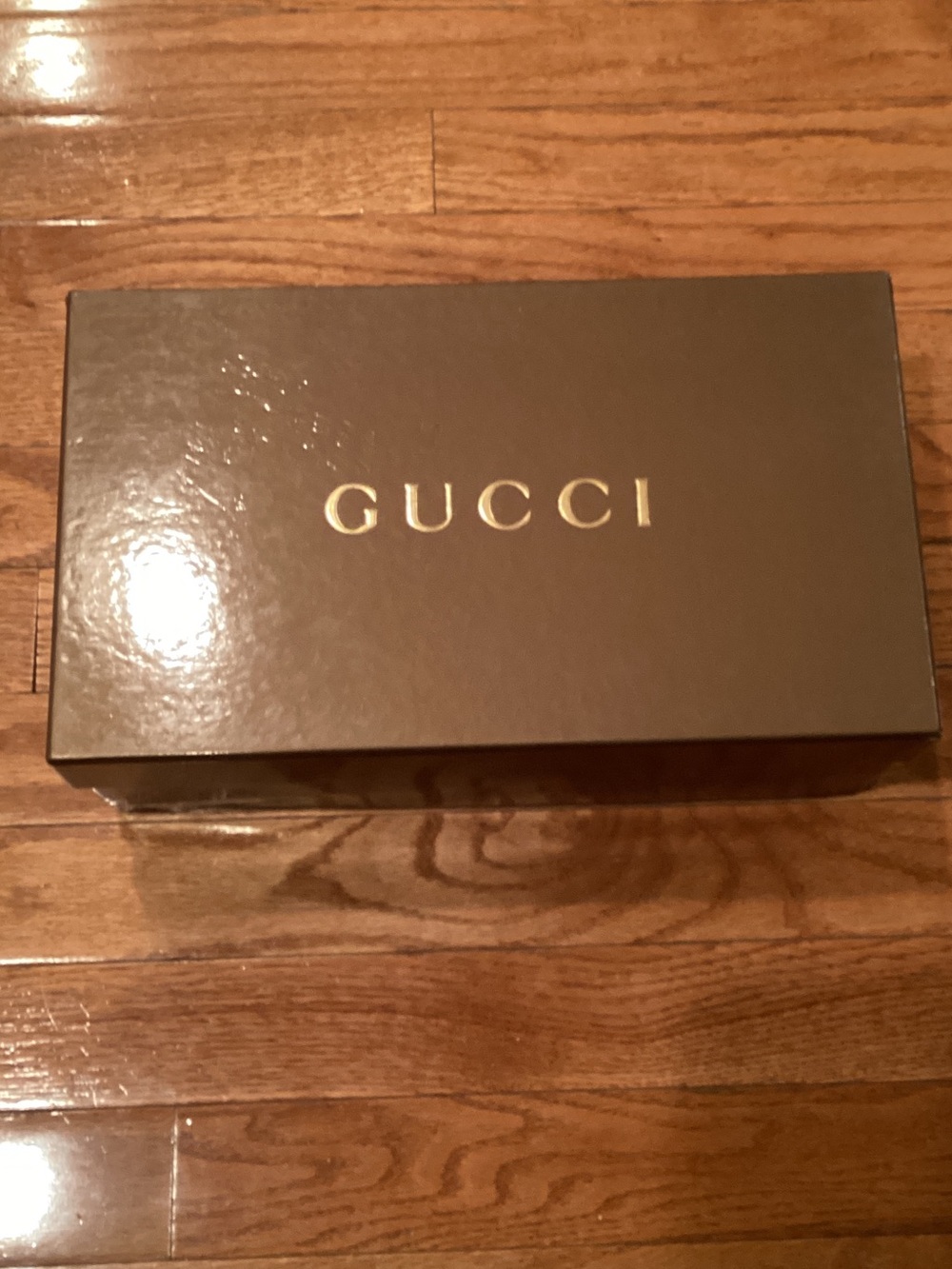 Gucci box likely eyewear or shoes